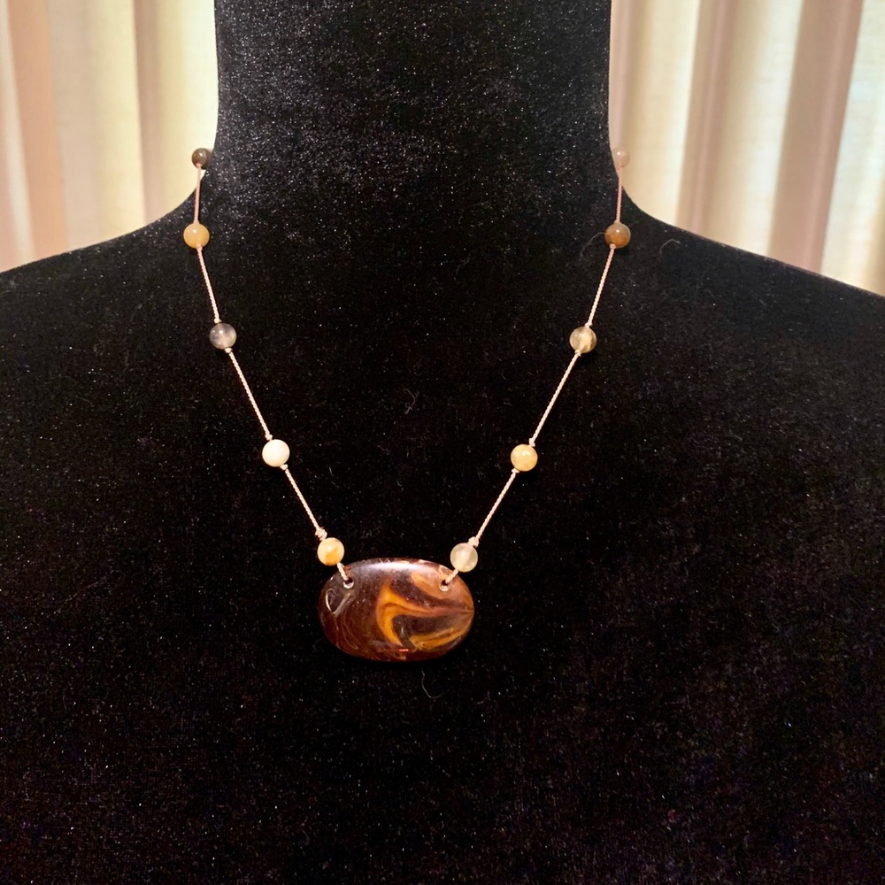 Short necklace with brown beads on string